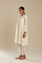 Off white short easy fit, straight hem kurta set with all-over trellis jaal appliqué, highlighted with sequins.