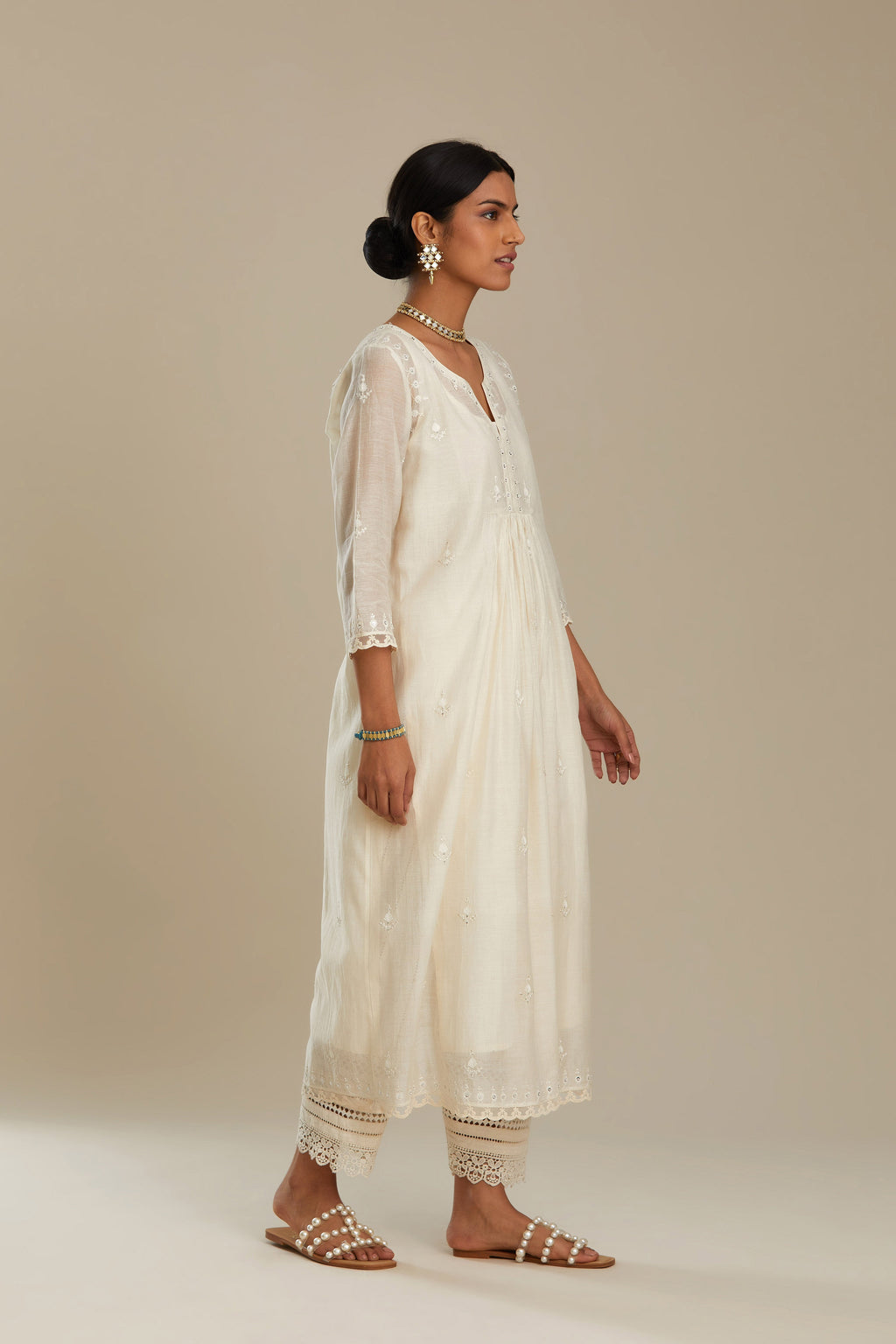 Cotton chanderi Kurta dress set with front gathers and all-over tonal thread embroidery, highlighted with sequins and beads.