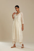 Cotton chanderi Kurta dress set with front gathers and all-over tonal thread embroidery, highlighted with sequins and beads.
