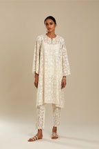 Off white short easy fit, straight hem kurta set with all-over trellis jaal appliqué, highlighted with sequins.