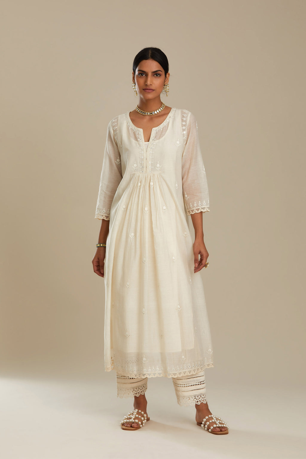 Cotton chanderi Kurta dress set with front gathers and all-over tonal thread embroidery, highlighted with sequins and beads.