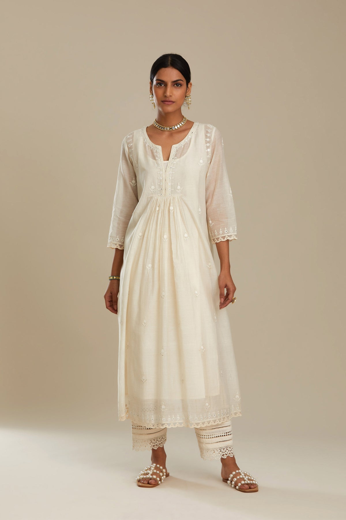 Cotton chanderi Kurta dress set with front gathers and all-over tonal thread embroidery, highlighted with sequins and beads.