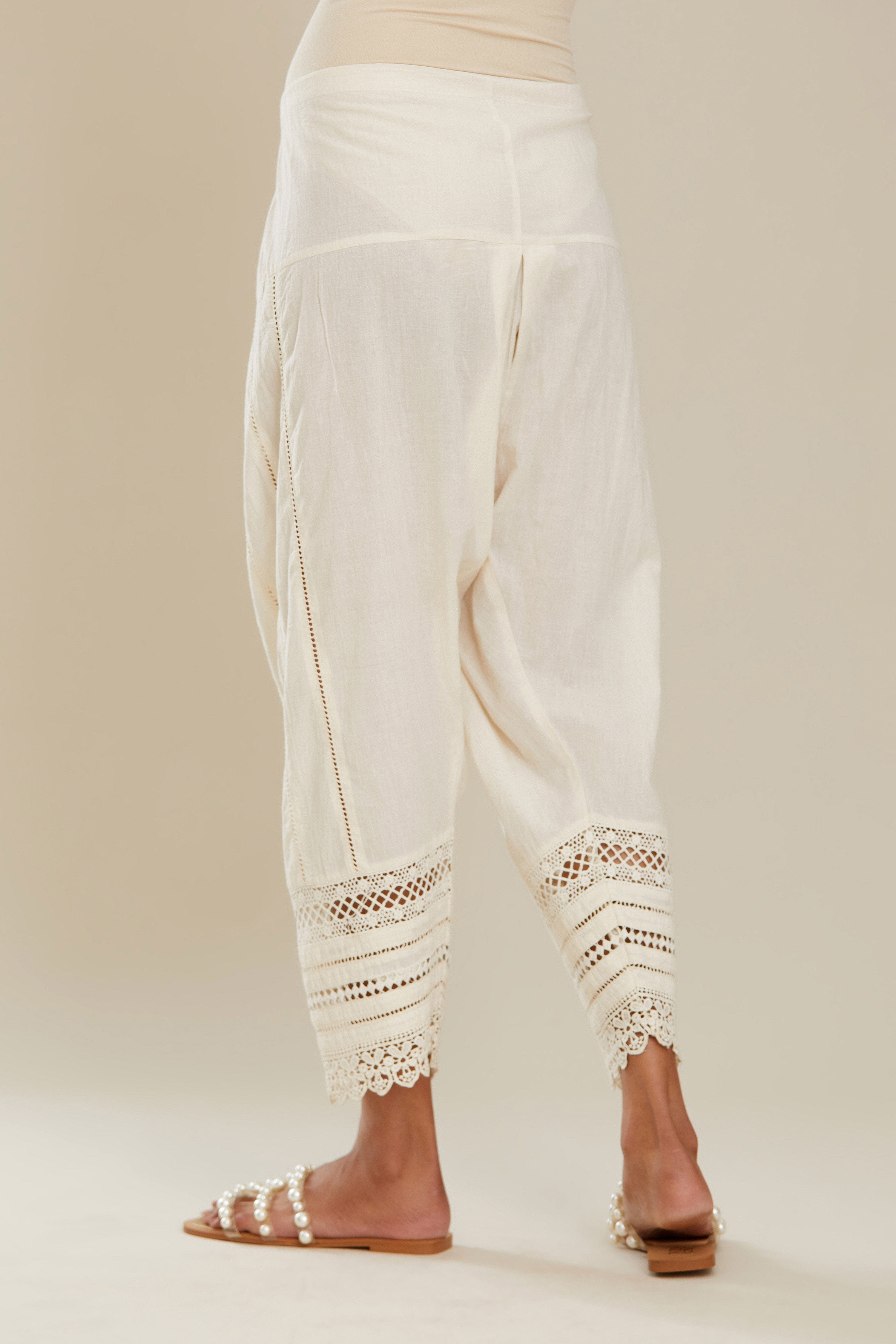 Off white cotton narrow salwar with assorted lace detailing. (Salwar)