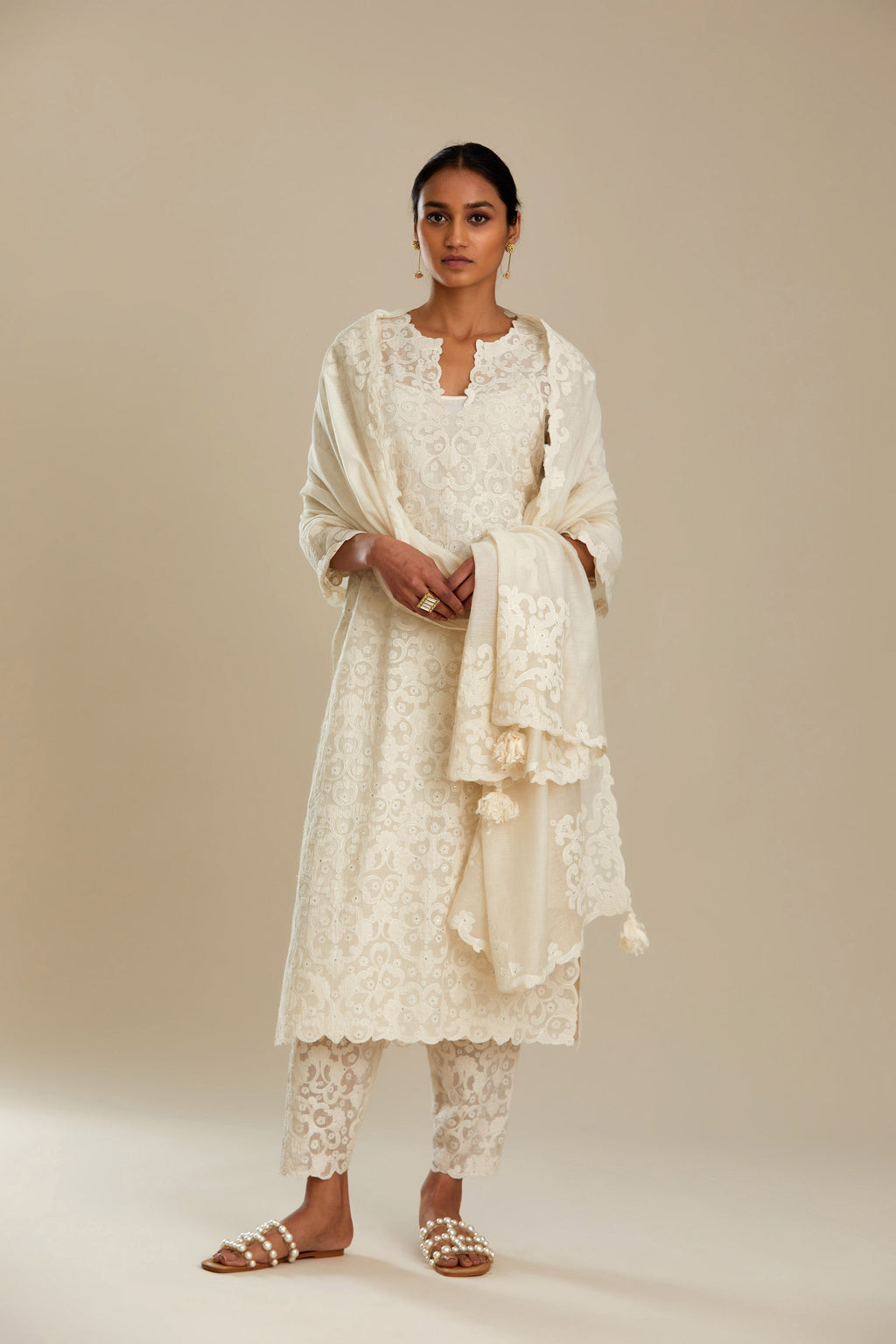 Off white straight kurta set with all-over cotton appliqué trellis jaal, highlighted with sequins.