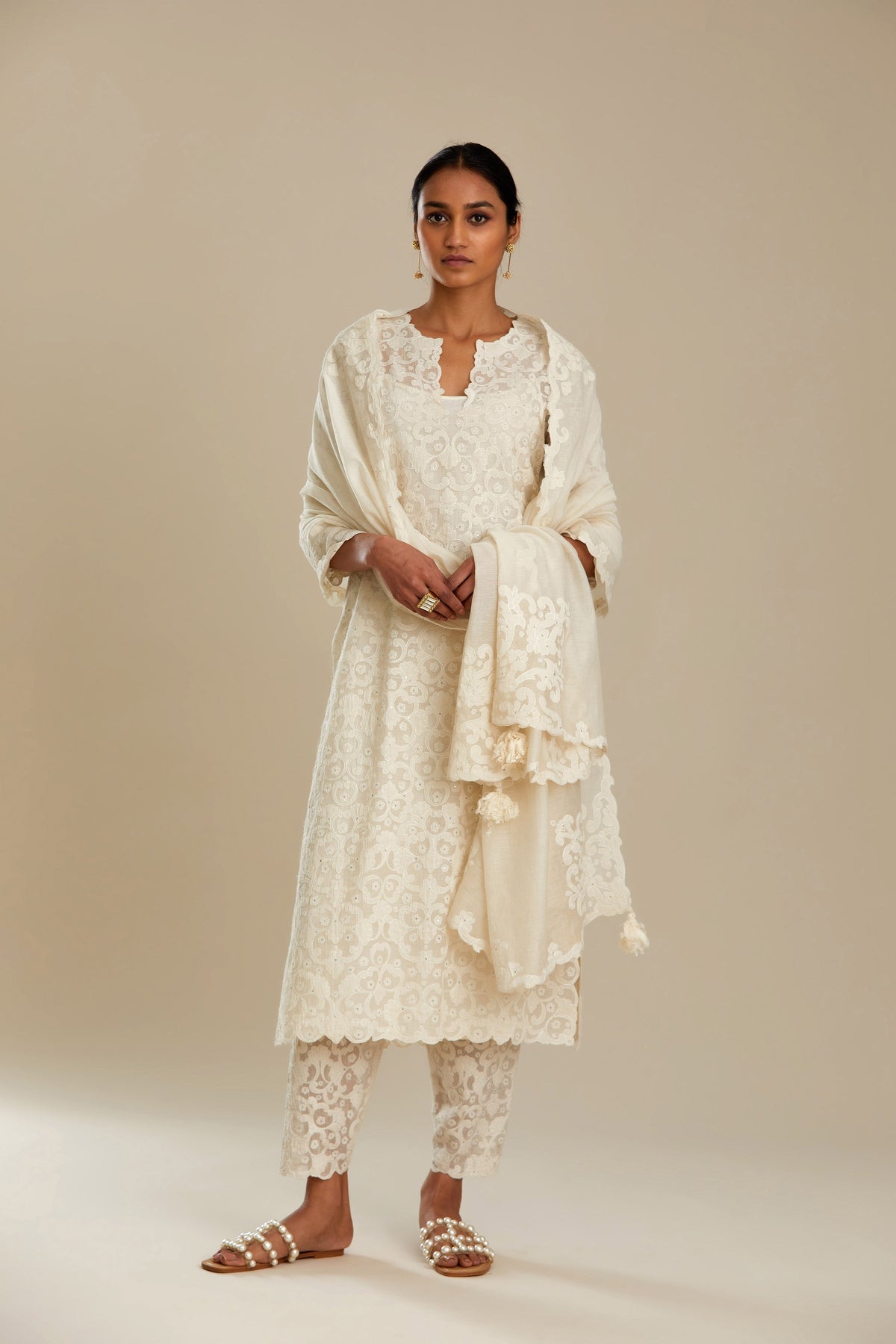 Off white straight kurta set with all-over cotton appliqué trellis jaal, highlighted with sequins.