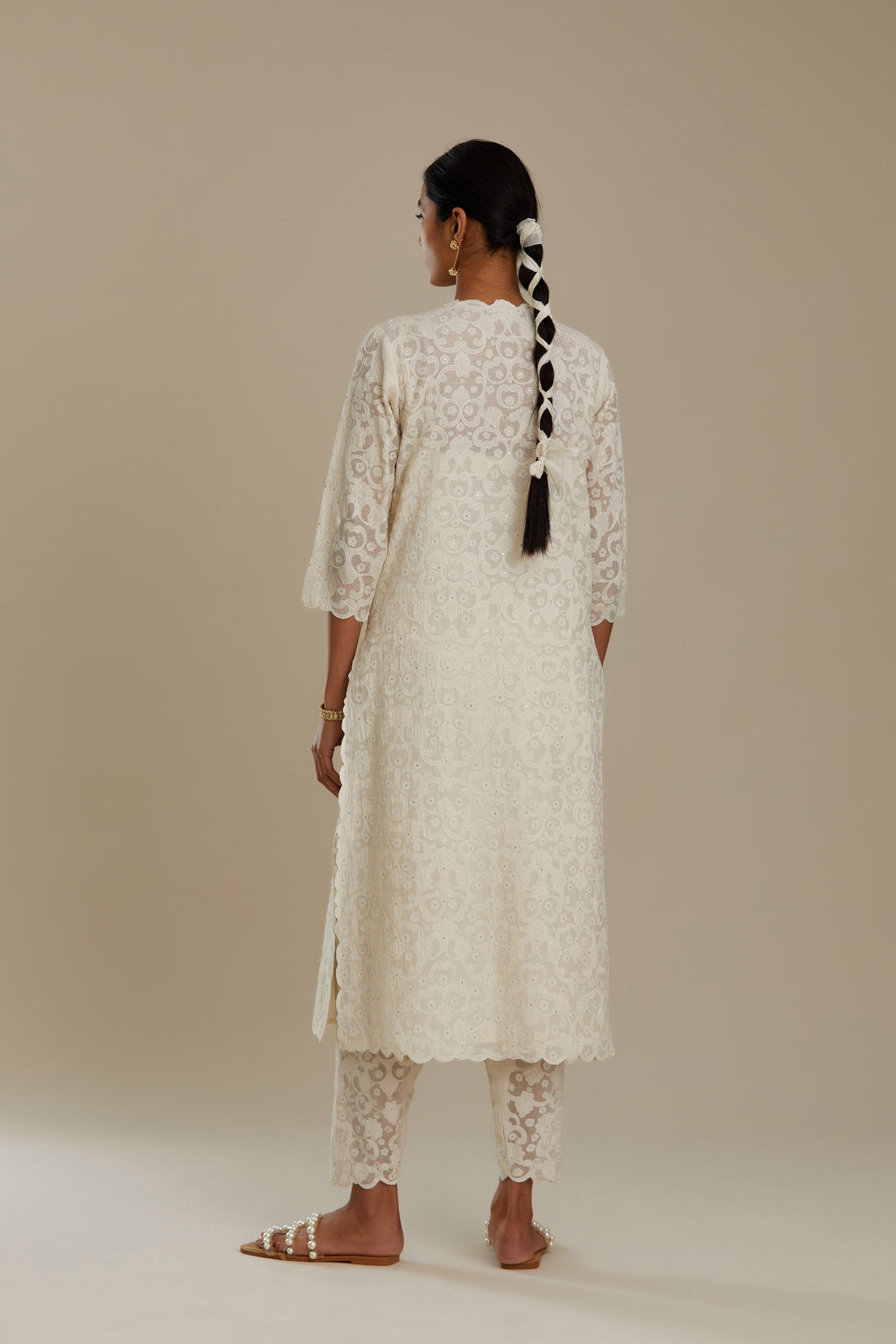 Off white straight kurta set with all-over cotton appliqué trellis jaal, highlighted with sequins.