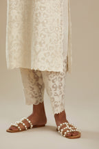 Off white straight kurta set with all-over cotton appliqué trellis jaal, highlighted with sequins.