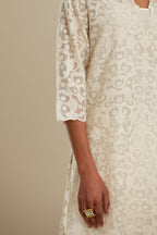 Off white straight kurta set with all-over cotton appliqué trellis jaal, highlighted with sequins.