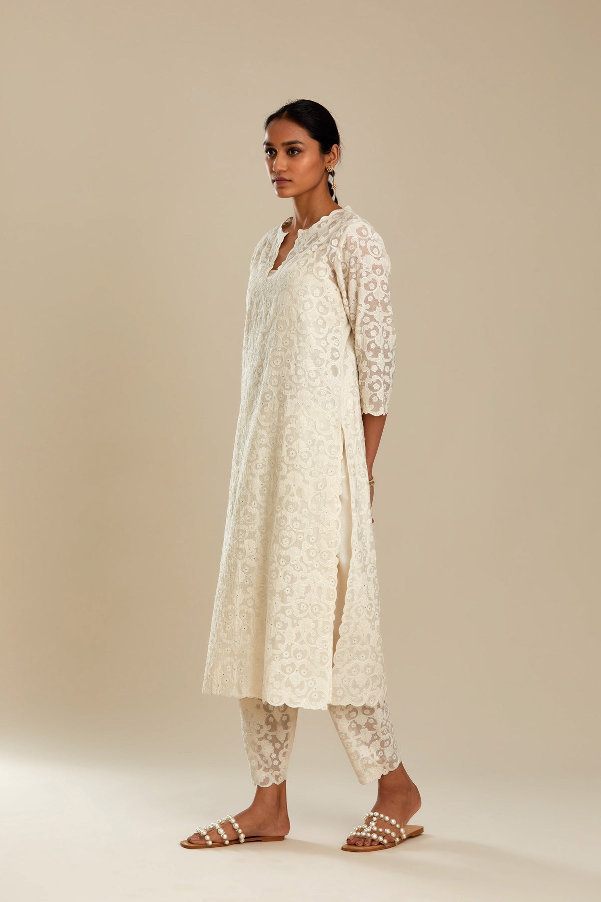 Off white straight kurta set with all-over cotton appliqué trellis jaal, highlighted with sequins.