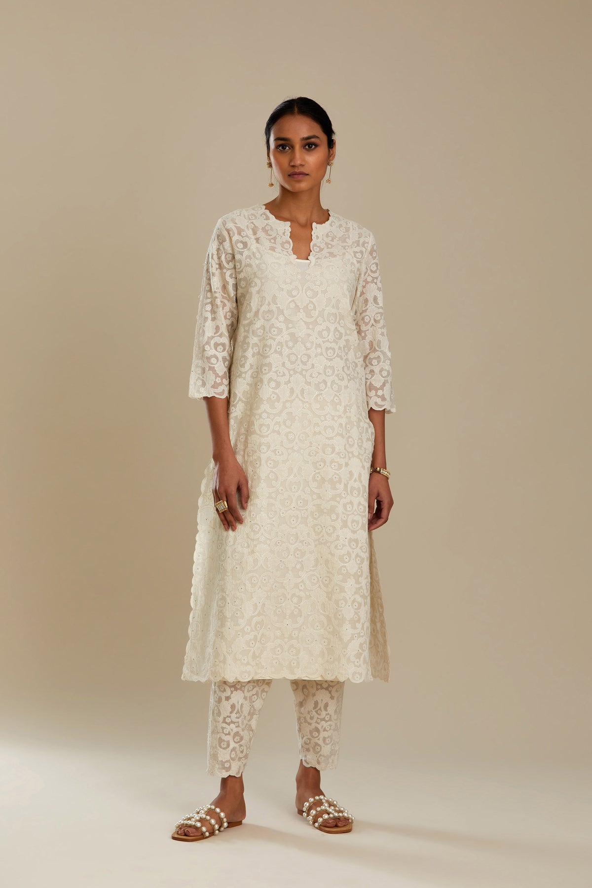 Off white straight kurta set with all-over cotton appliqué trellis jaal, highlighted with sequins.