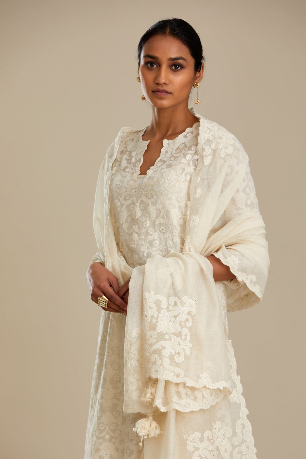 Off white straight kurta set with all-over cotton appliqué trellis jaal, highlighted with sequins.