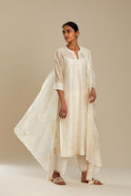 Silk chanderi straight kurta set, embroidered with tonal silk thread. Worn with a slip.