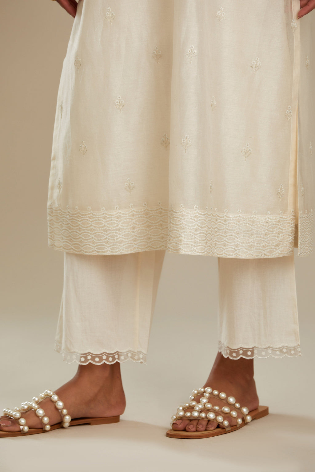 Silk chanderi straight kurta set, embroidered with tonal silk thread. Worn with a slip.
