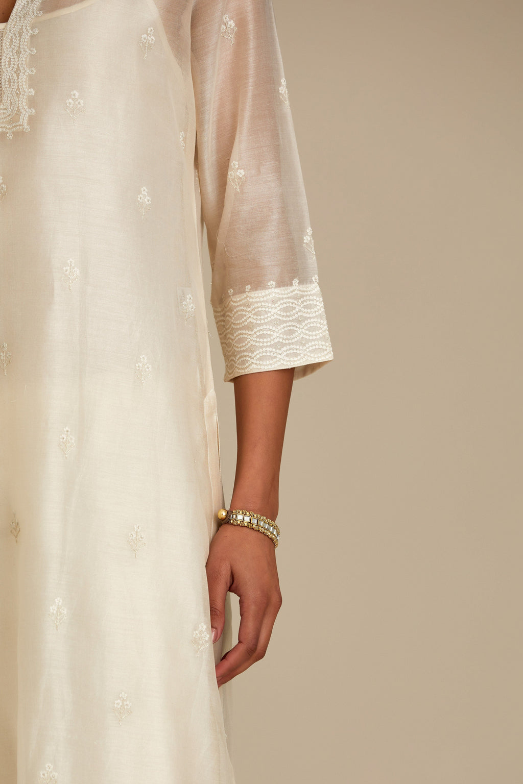Silk chanderi straight kurta set, embroidered with tonal silk thread. Worn with a slip.
