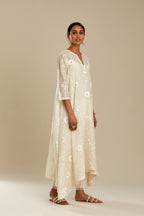 Off white cotton Chanderi kurta set with fagotting and an asymmetric hem, highlighted with silk thread floral jaal embroidery and sequins.
