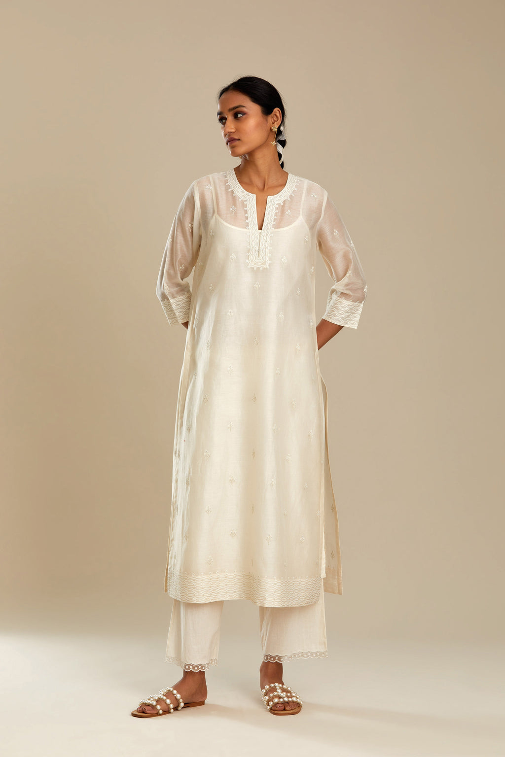 Silk chanderi straight kurta set, embroidered with tonal silk thread. Worn with a slip.