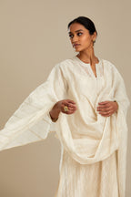 Off white cotton chanderi dupatta with silver zari and silk thread trellises running diagonally all over the dupatta. (Dupatta)