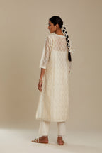 Off white silk chanderi straight kurta set with all over thread and zari jaal embroidery at central panel and striped trellis detail at kalis.