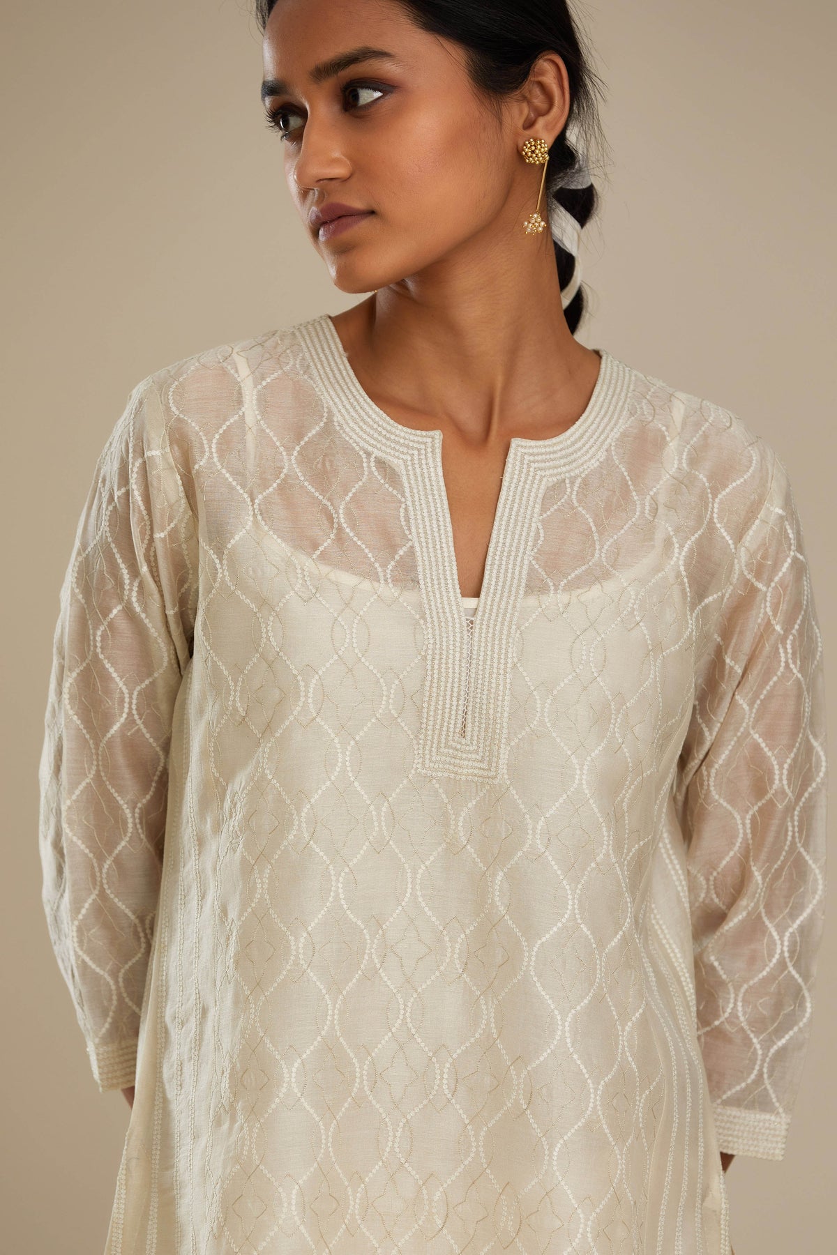 Off white silk chanderi straight kurta set with all over thread and zari jaal embroidery at central panel and striped trellis detail at kalis.