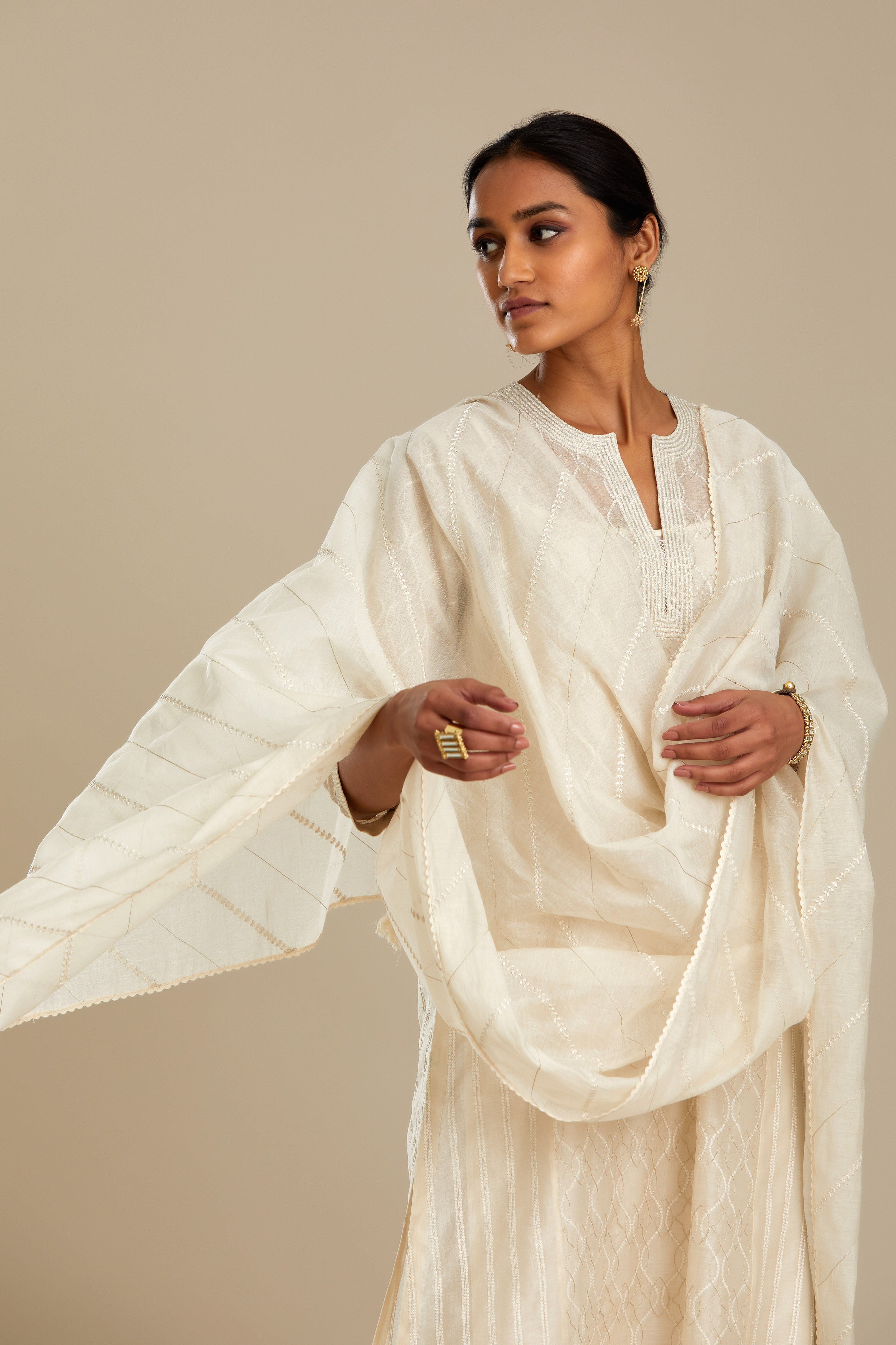 Off white silk chanderi straight kurta set with all over thread and zari jaal embroidery at central panel and striped trellis detail at kalis.