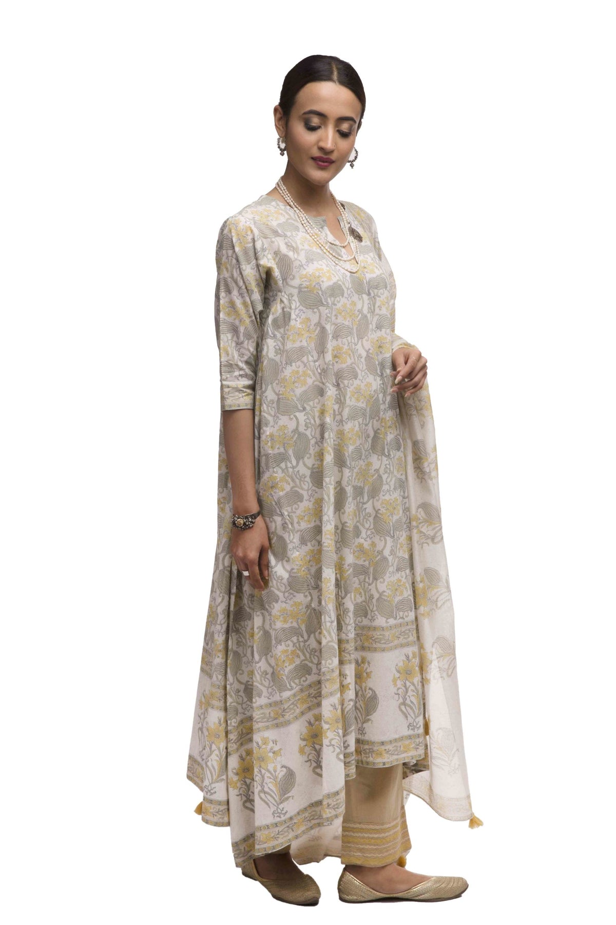 Asymmetric hem kurta with all-over hand block print with broad contrast border print at hem & Straight pant with quilted embroidered hem