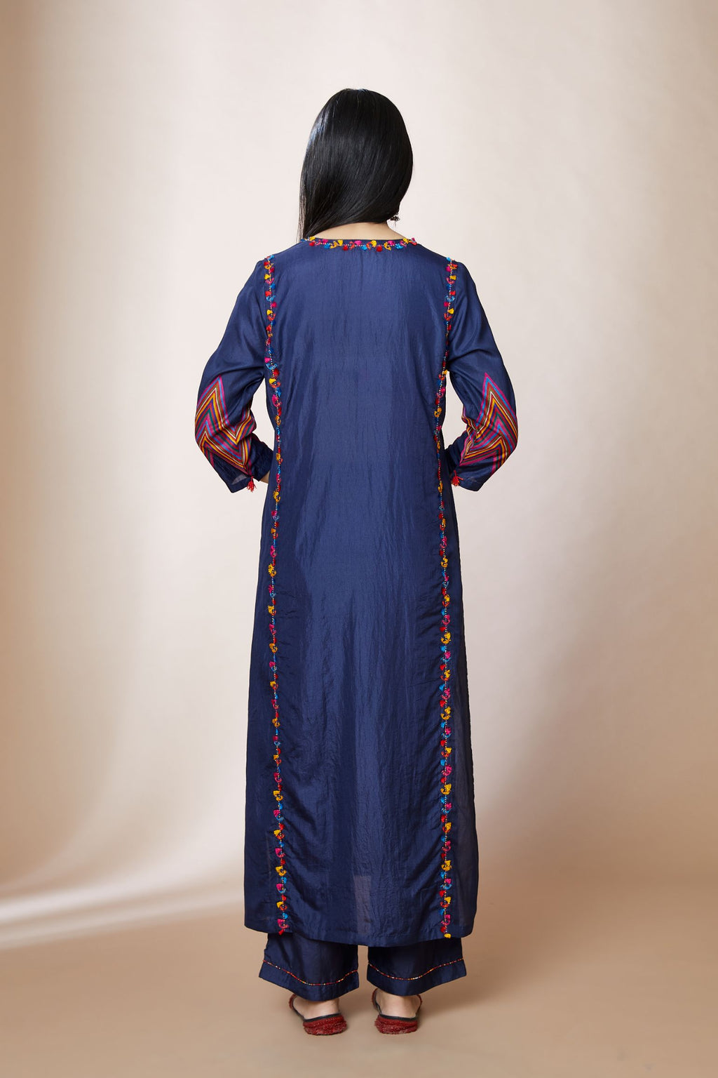 Electric blue silk straight kurta set with multi bead and tassel thread embroidery. Chevron detail at sleeves