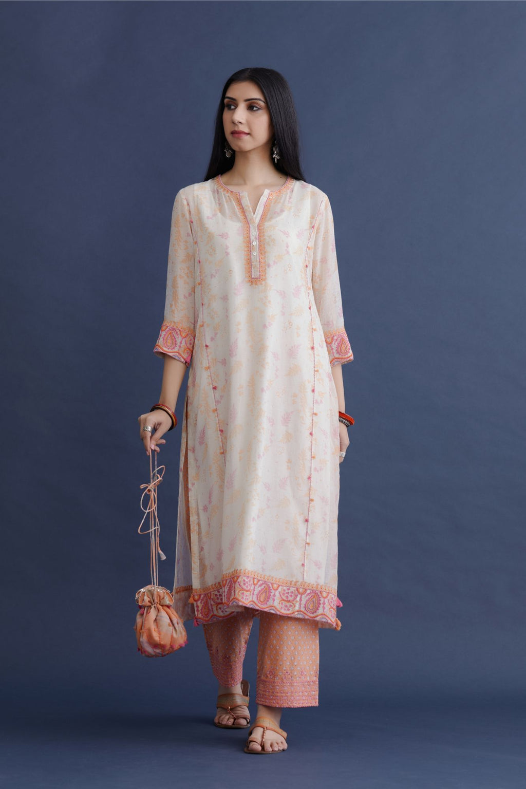 Off white straight kurta set with embroidered button placket neckline and delicate bead and tassel embroidery at side panel joint seams