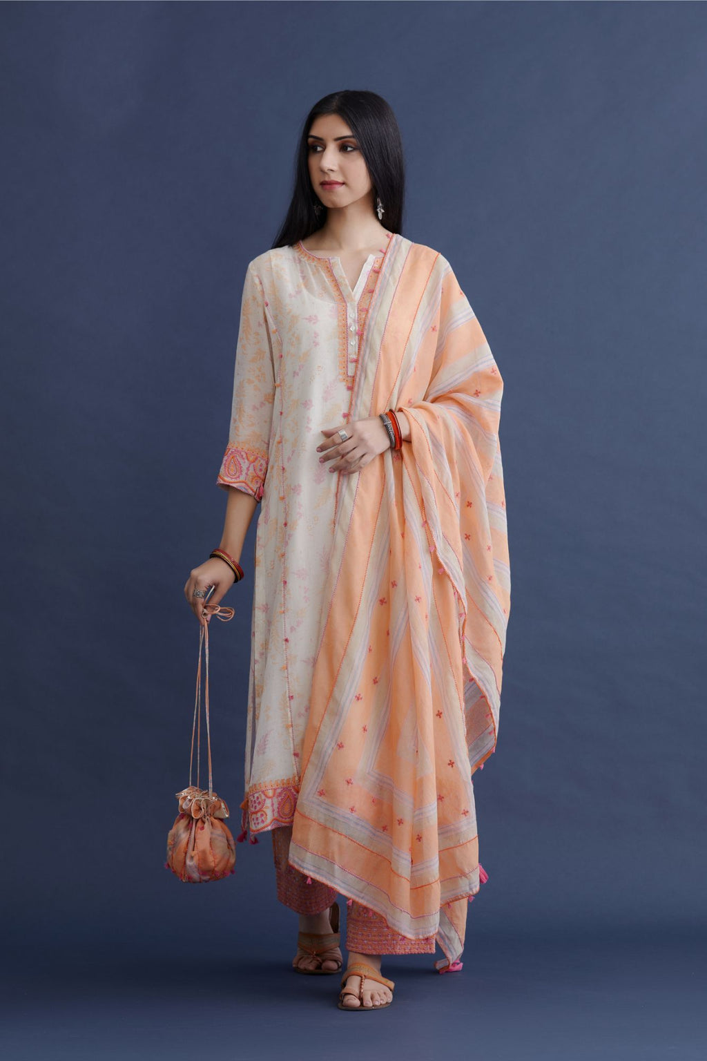 Off white straight kurta set with embroidered button placket neckline and delicate bead and tassel embroidery at side panel joint seams