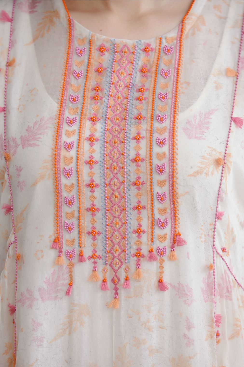 Hand block printed cotton Chanderi kurta set with cotton slip inside, highlighted with all-over pink and orange beads and thread embroidery