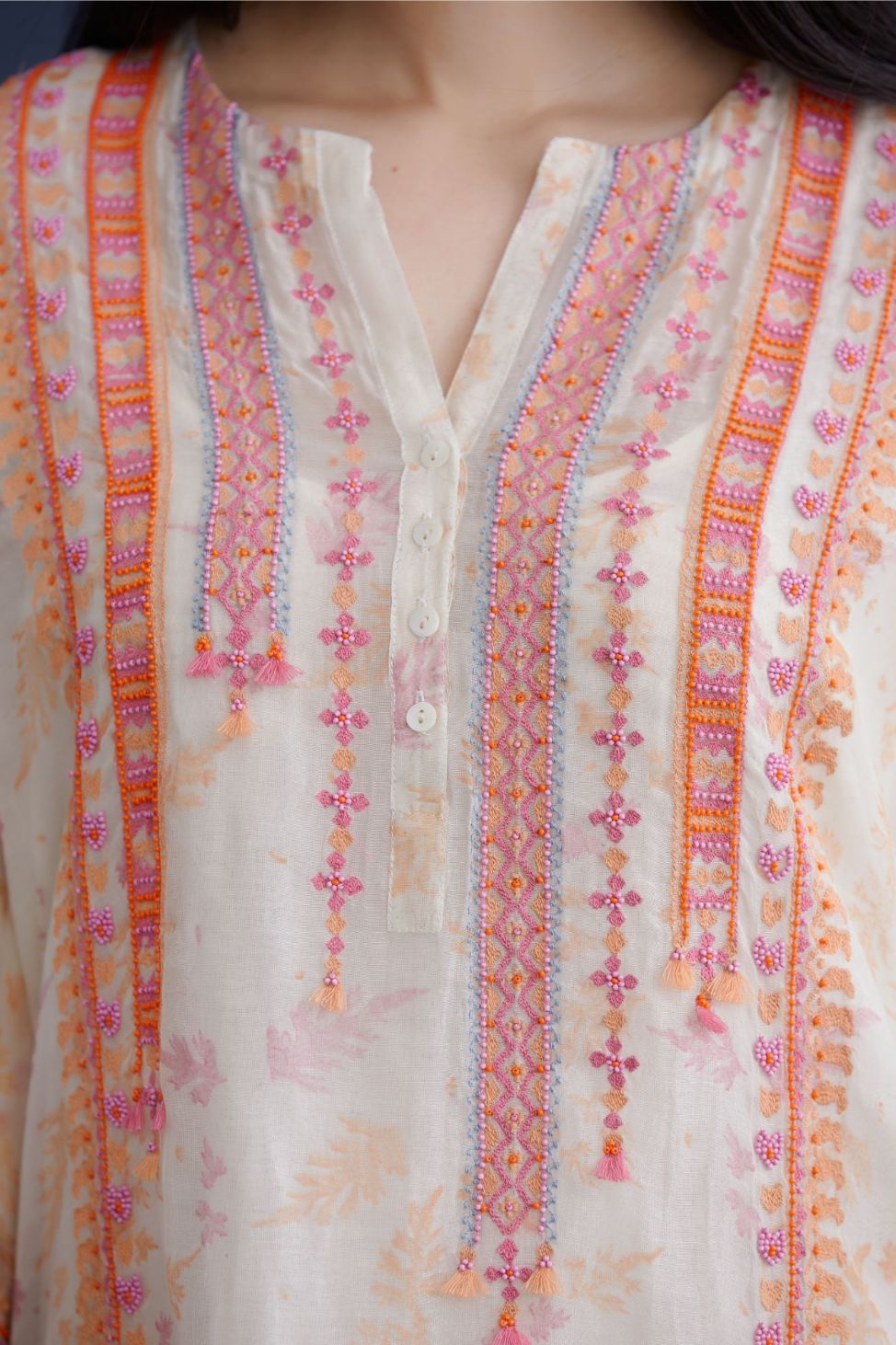 Off white hand block printed short kurta set, highlighted with delicate bead and thread embroidery