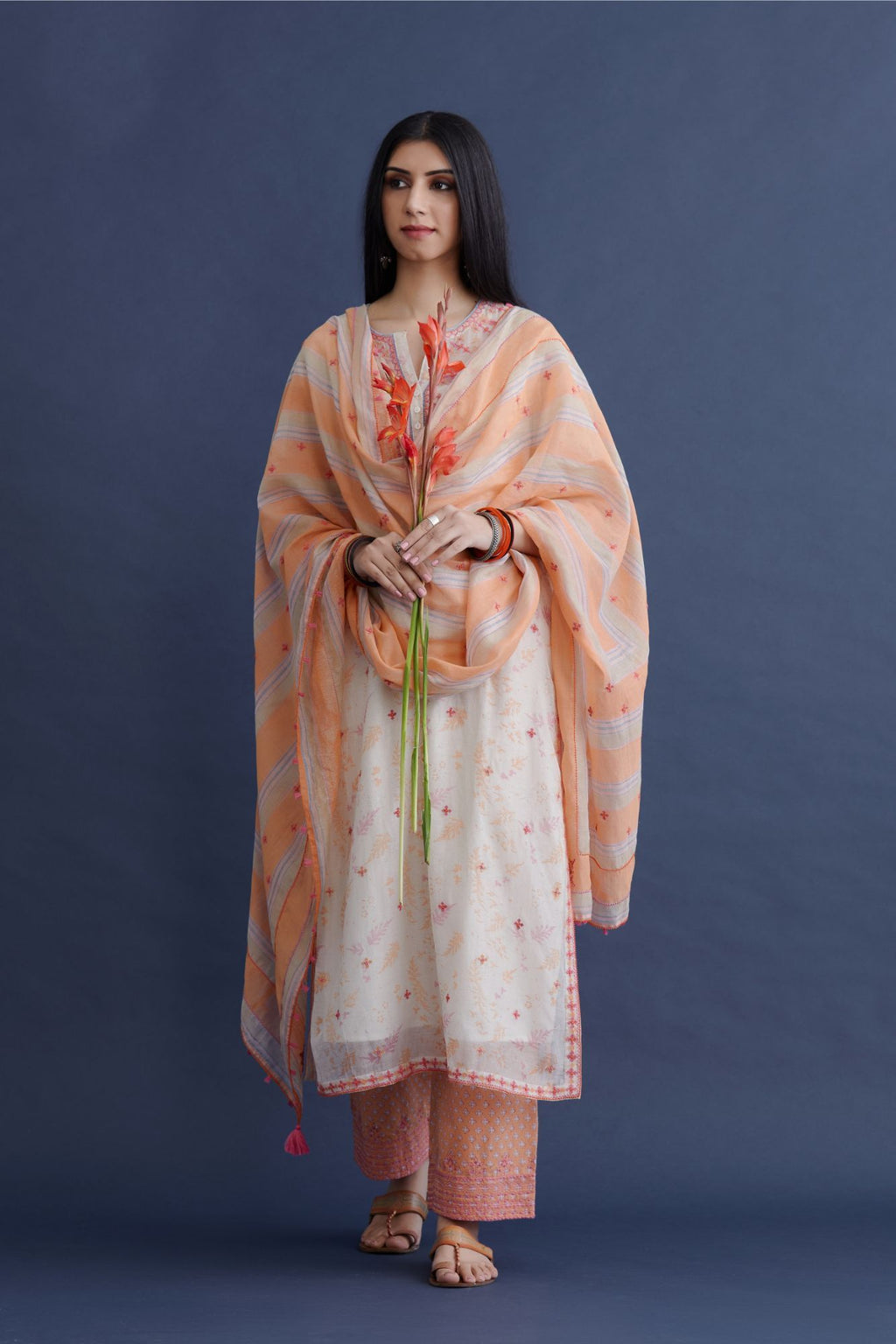 Off white hand block printed straight kurta set with all-over pink and orange thread embroidery and delicate beaded hand work