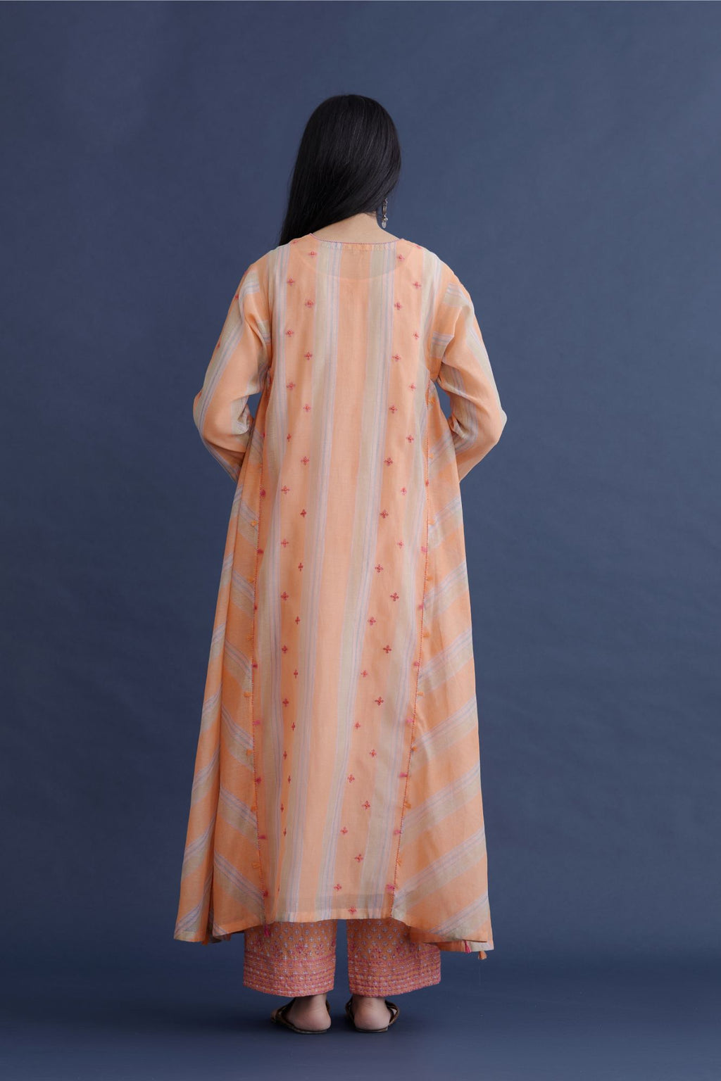 Orange beige and soft blue hand block printed striped cotton Chanderi kurta set with asymmetric hem, highlighted with delicate bead and tassel embroidery