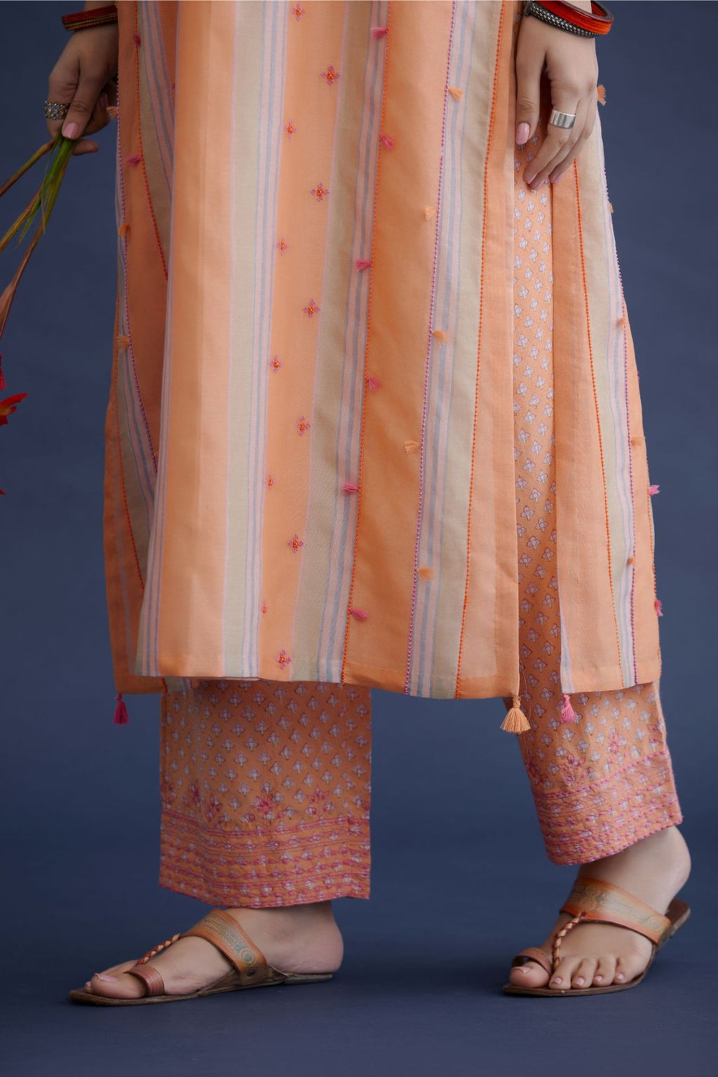 Orange beige and soft blue hand block printed striped cotton Chanderi straight kurta set, highlighted with delicate bead and tassel embroidery