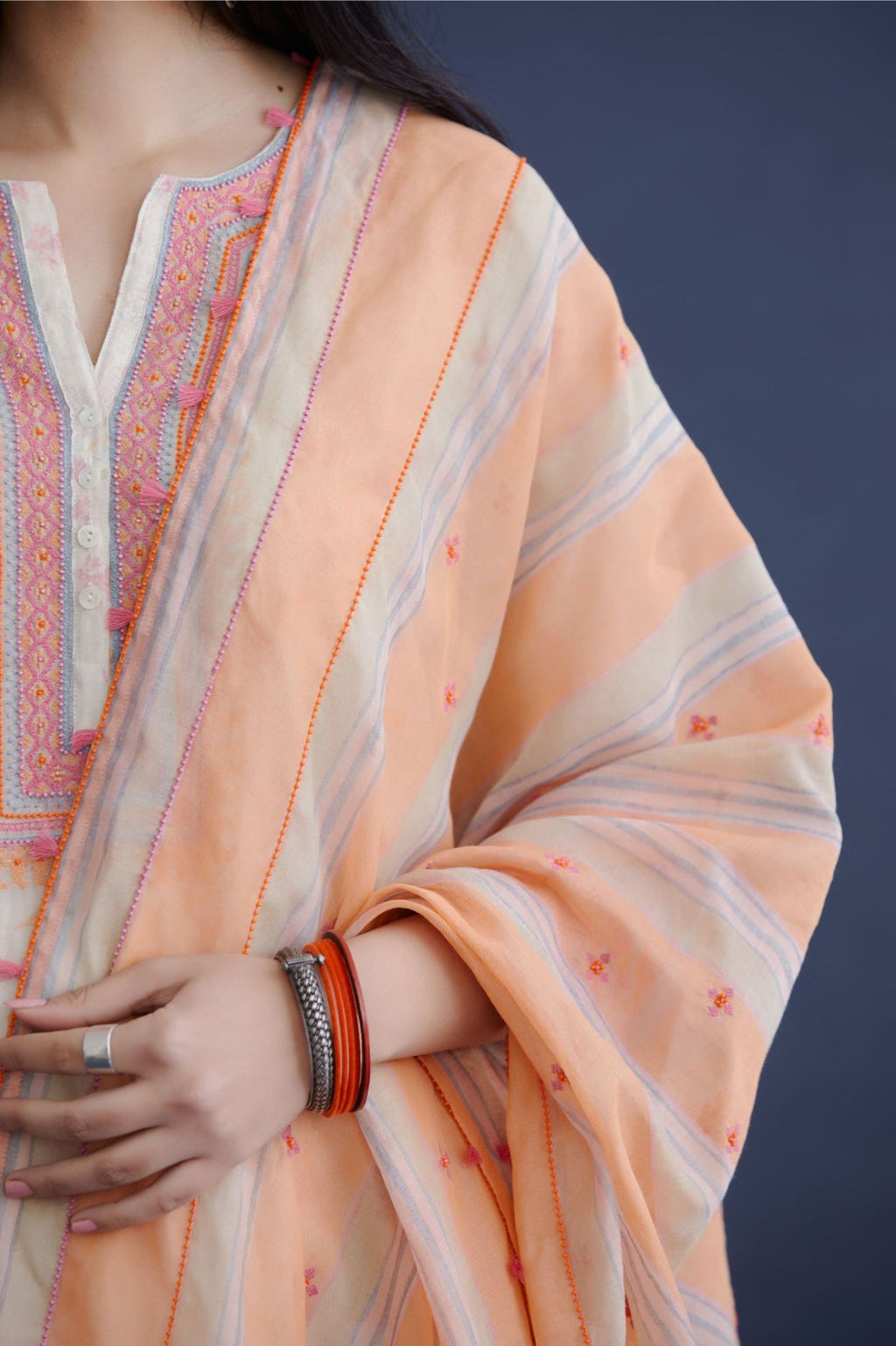 Orange and blue hand block printed cotton Chanderi dupatta with all-over delicate beads and tassels embroidery