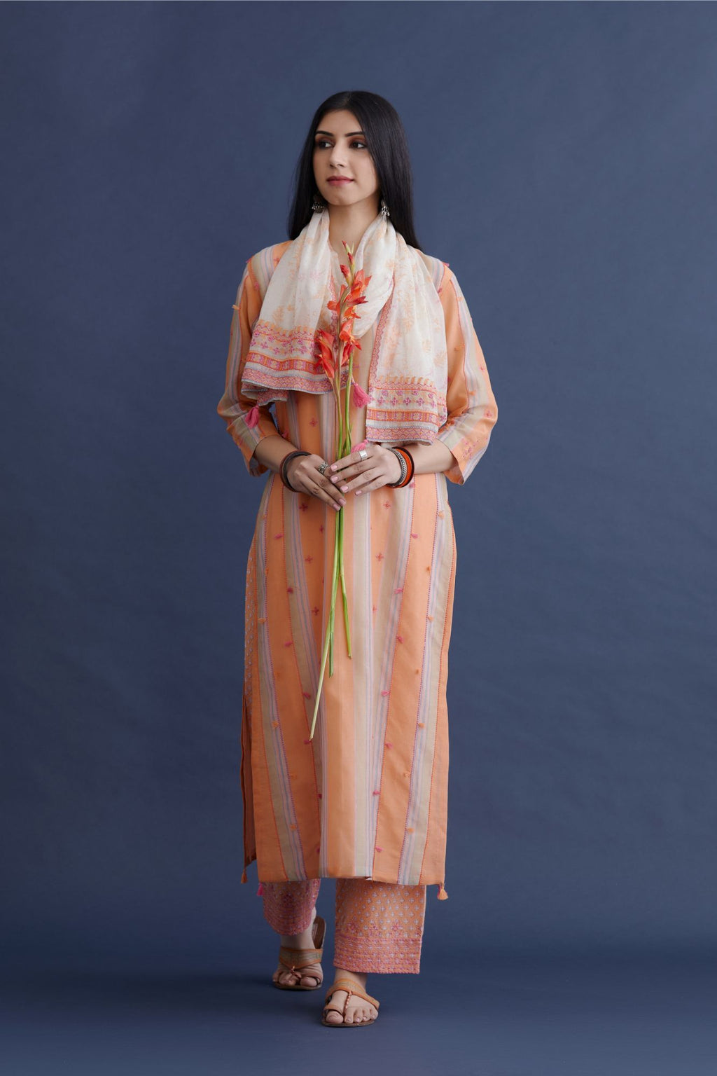 Off white cotton Chanderi narrow stole with all over pink and orange hand block print, highlighted with beads and thread embroidery at sides