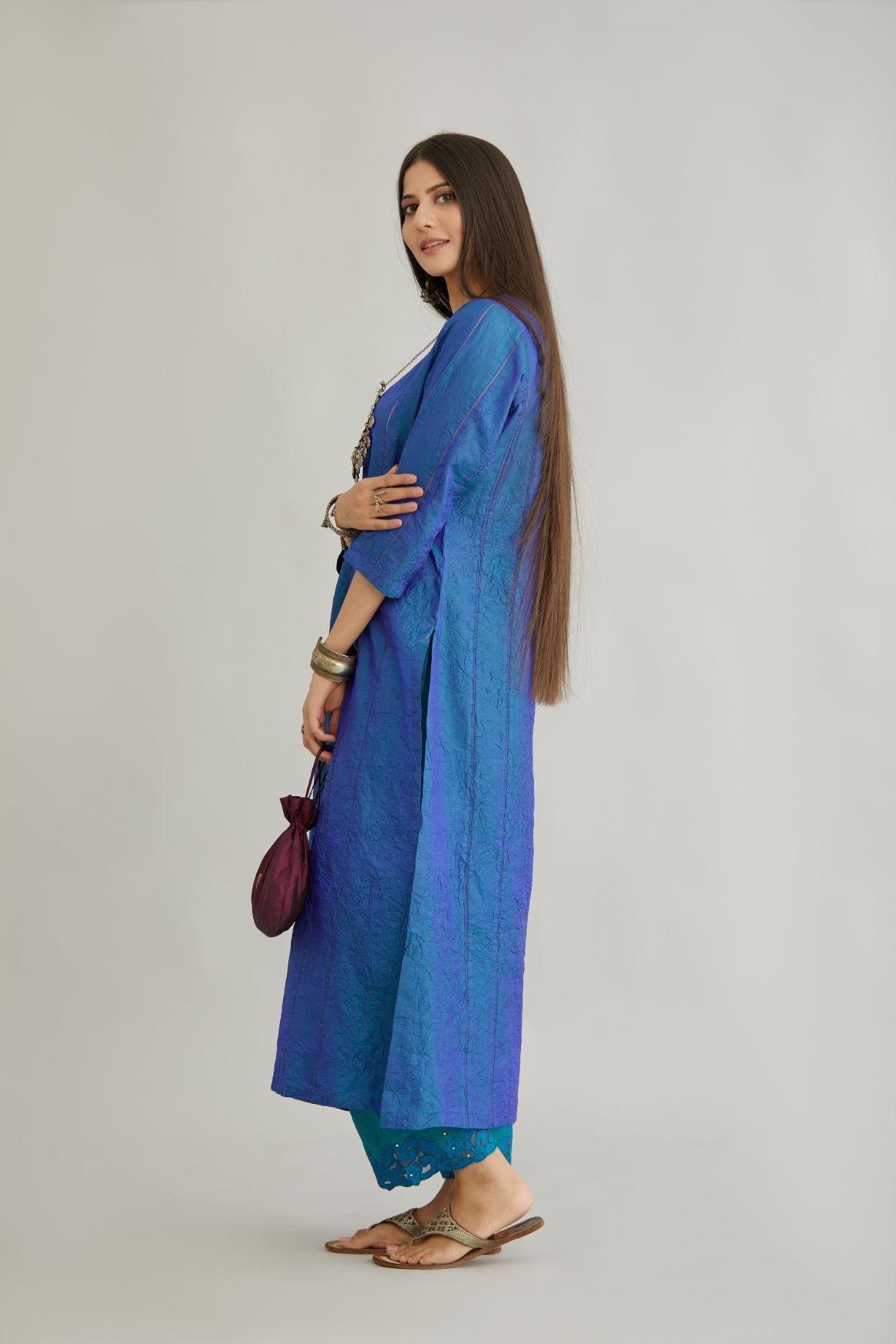 Teal blue hand crushed silk straight kurta set with vertical organza fabric inset stripe detail in front, back and 3/4 sleeves, highlighted with contrasting top stitch.