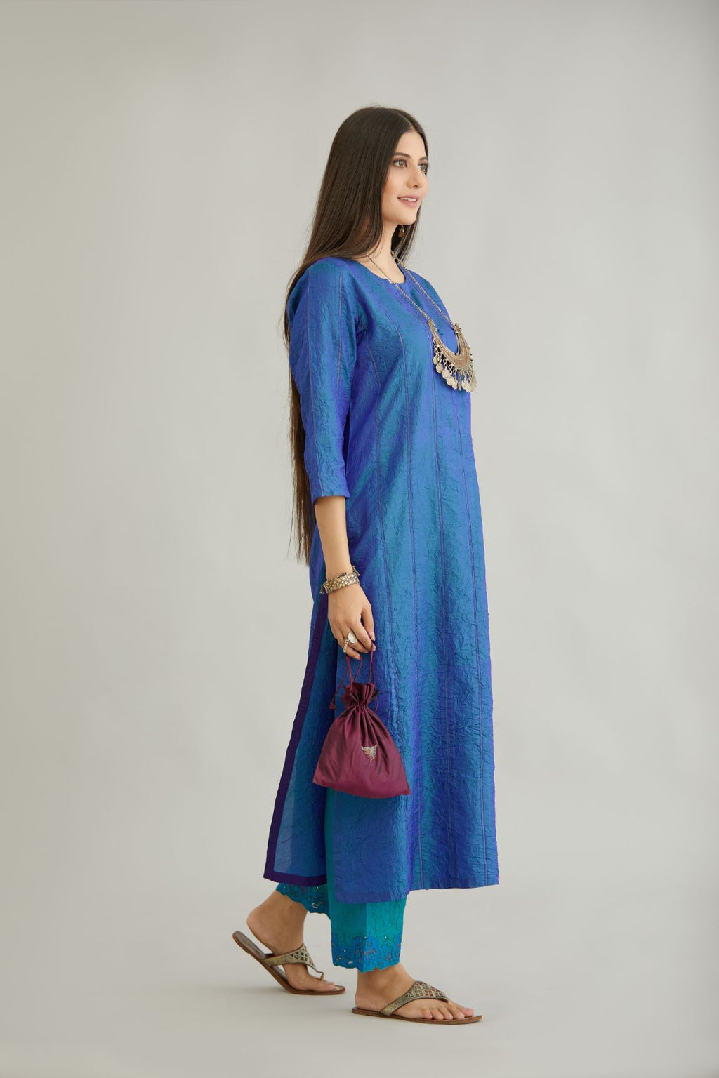 Teal blue hand crushed silk straight kurta set with vertical organza fabric inset stripe detail in front, back and 3/4 sleeves, highlighted with contrasting top stitch.