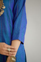 Teal blue hand crushed silk straight kurta set with vertical organza fabric inset stripe detail in front, back and 3/4 sleeves, highlighted with contrasting top stitch.