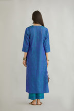 Teal blue hand crushed silk straight kurta set with vertical organza fabric inset stripe detail in front, back and 3/4 sleeves, highlighted with contrasting top stitch.