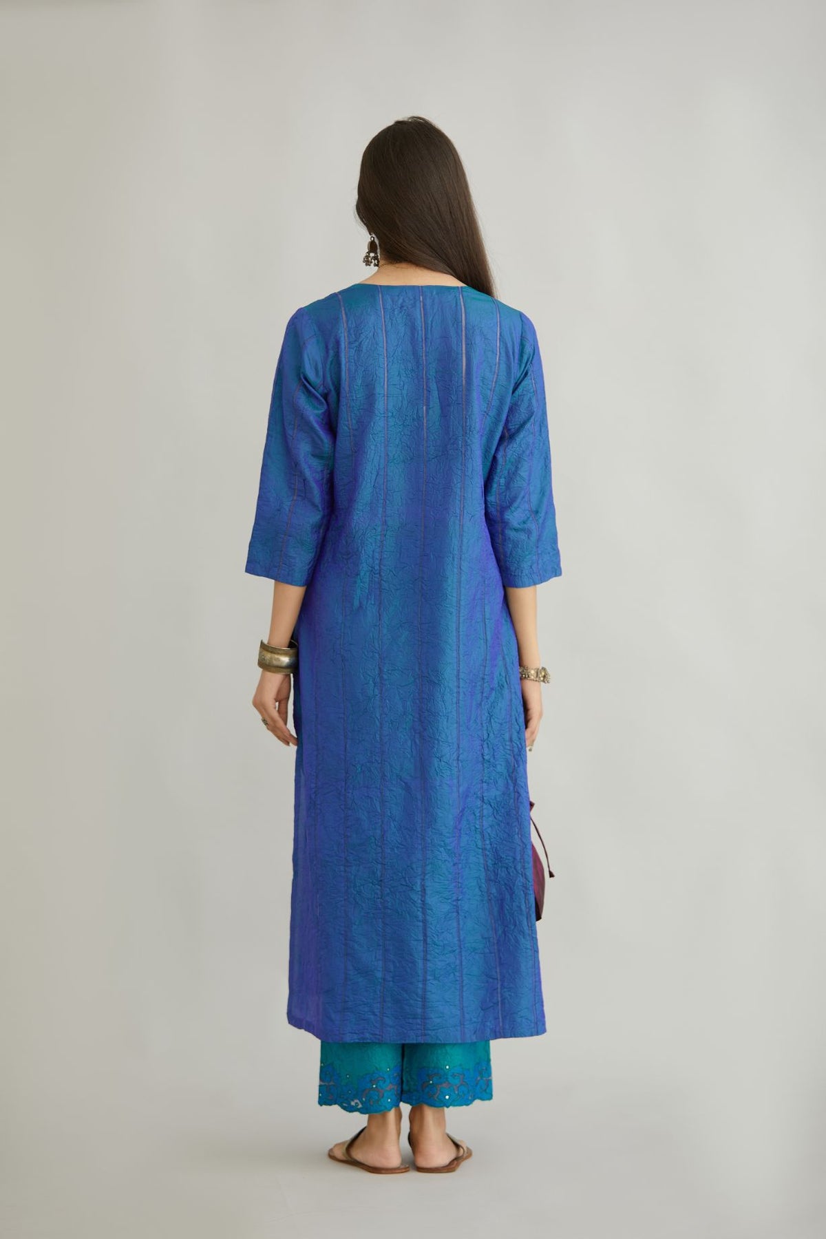 Teal blue hand crushed silk straight kurta set with vertical organza fabric inset stripe detail in front, back and 3/4 sleeves, highlighted with contrasting top stitch.