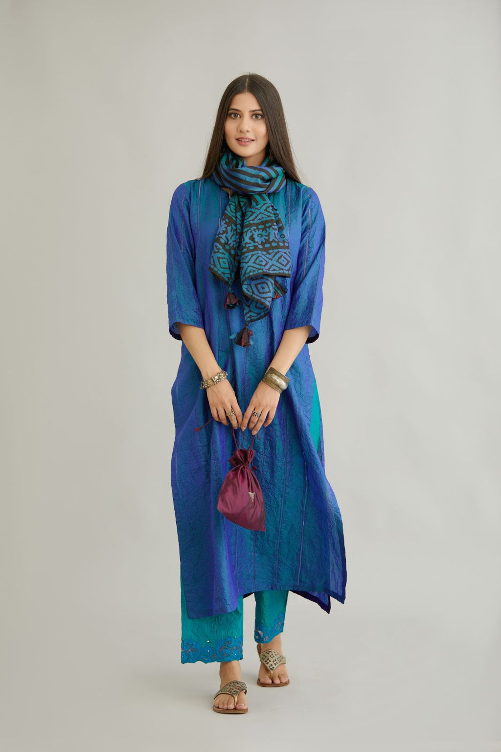 Teal blue hand crushed silk straight kurta set with vertical organza fabric inset stripe detail in front, back and 3/4 sleeves, highlighted with contrasting top stitch.