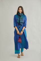 Teal blue hand crushed silk straight kurta set with vertical organza fabric inset stripe detail in front, back and 3/4 sleeves, highlighted with contrasting top stitch.