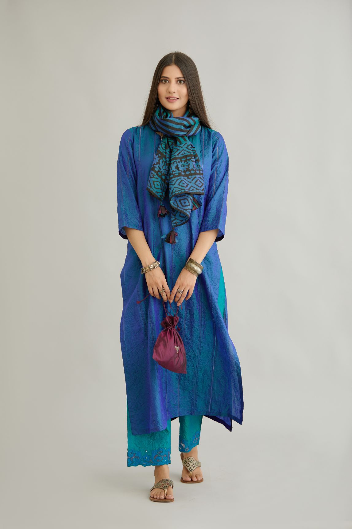 Teal blue hand crushed silk straight kurta set with vertical organza fabric inset stripe detail in front, back and 3/4 sleeves, highlighted with contrasting top stitch.