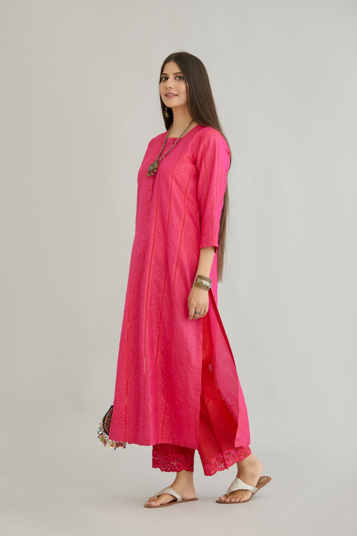 Fuchsia hand crushed silk straight kurta set with vertical organza fabric inset stripe detail in front, back and 3/4 sleeves, highlighted with contrasting top stitch.