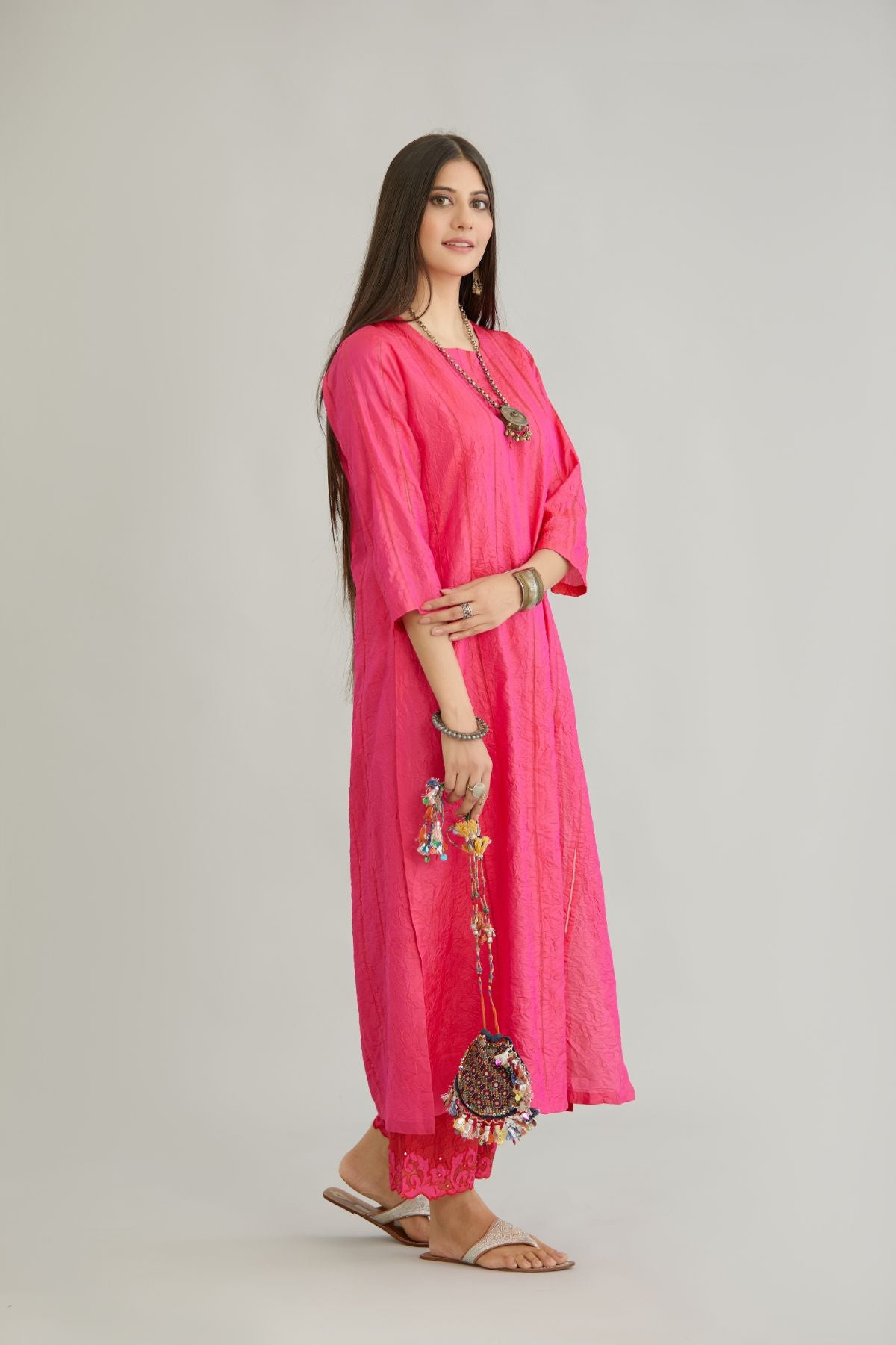 Fuchsia hand crushed silk straight kurta set with vertical organza fabric inset stripe detail in front, back and 3/4 sleeves, highlighted with contrasting top stitch.