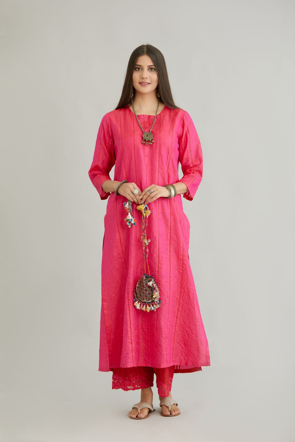 Fuchsia hand crushed silk straight kurta set with vertical organza fabric inset stripe detail in front, back and 3/4 sleeves, highlighted with contrasting top stitch.