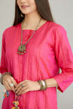 Fuchsia hand crushed silk straight kurta set with vertical organza fabric inset stripe detail in front, back and 3/4 sleeves, highlighted with contrasting top stitch.