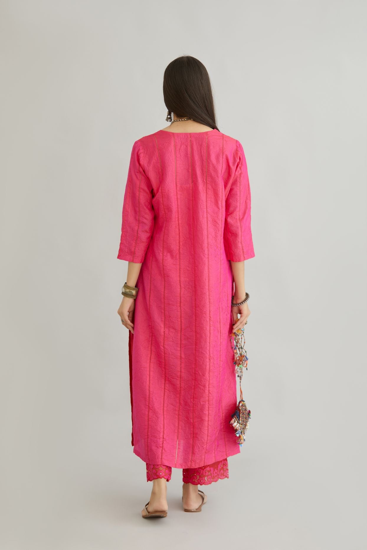 Fuchsia hand crushed silk straight kurta set with vertical organza fabric inset stripe detail in front, back and 3/4 sleeves, highlighted with contrasting top stitch.