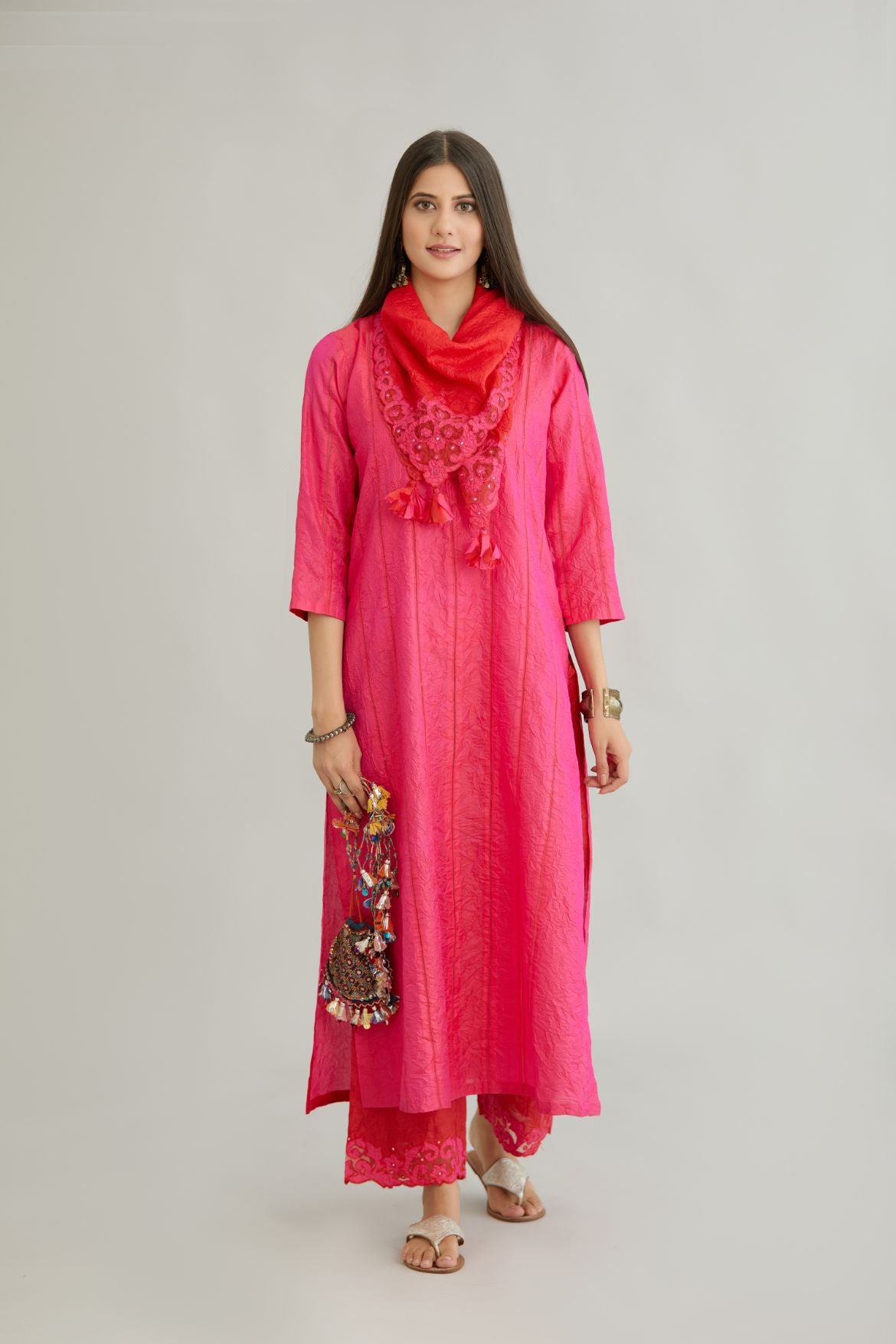Fuchsia hand crushed silk straight kurta set with vertical organza fabric inset stripe detail in front, back and 3/4 sleeves, highlighted with contrasting top stitch.