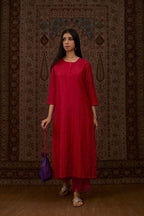 Red hand crushed silk straight kurta set with vertical organza fabric inset stripe detail in front, back and 3/4 sleeves, highlighted with contrasting top stitch.